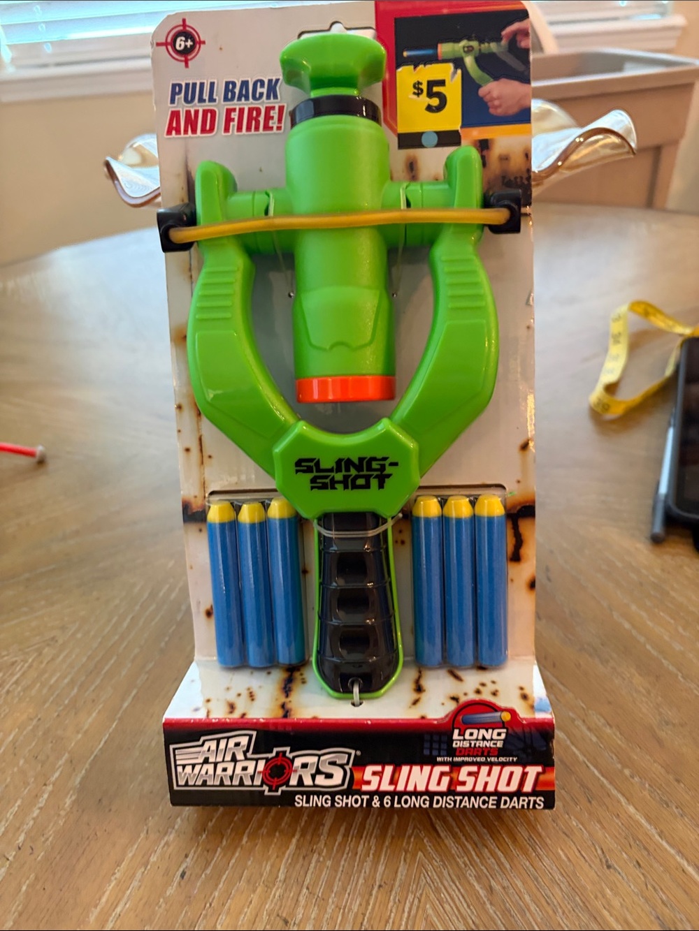 Green Sling Shot with Blue Darts